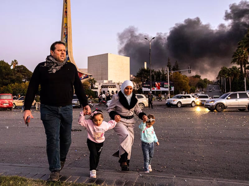 People take to the streets of Damascus, Syria, to celebrate the fall of the Assad regime, Dec. 8, 2024.