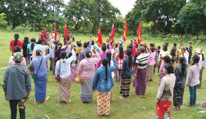 Protesters give a three-finger salute signaling their opposition to the junta at a rally in Sagaing region, Aug. 8, 2022. Credit: Citizen journalist