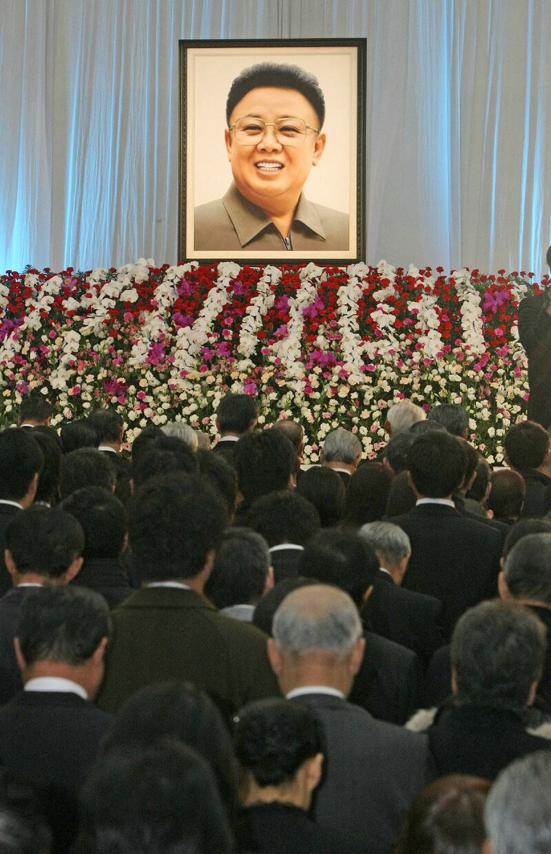 Zainichi Koreans in Japan pray for the late North Korean leader Kim Jong Il during a memorial service at a Korean cultural center in Tokyo on Dec. 29, 2011, shortly after his death.