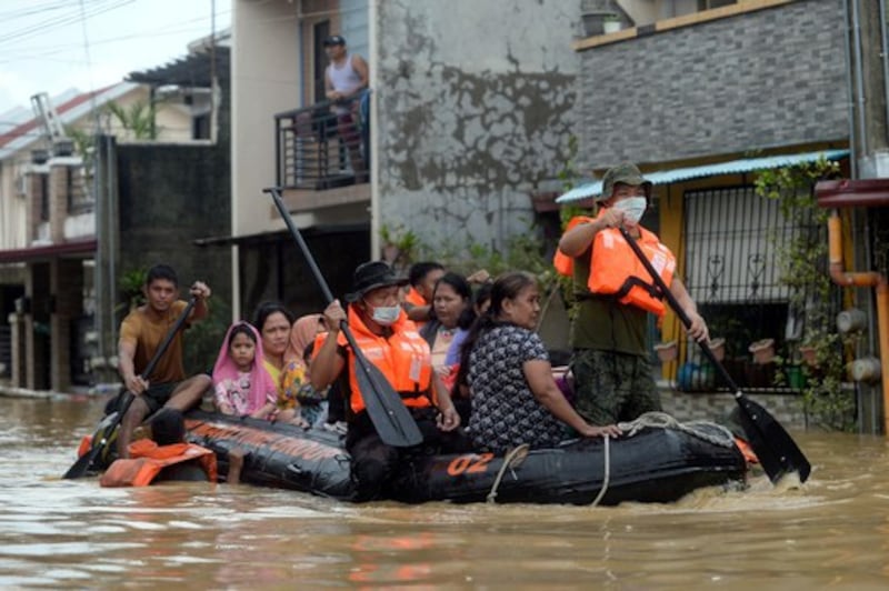 Residents are evacuated from their flooded houses on a rescue boat following Typhoon Vamco, in Rizal Province, Philippines, Nov. 12, 2020. Credit: Reuters