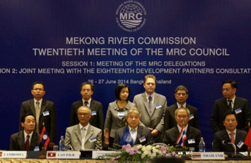 Mekong River Commission officials pose for a photo during their meeting in Bangkok, June 26, 2014.