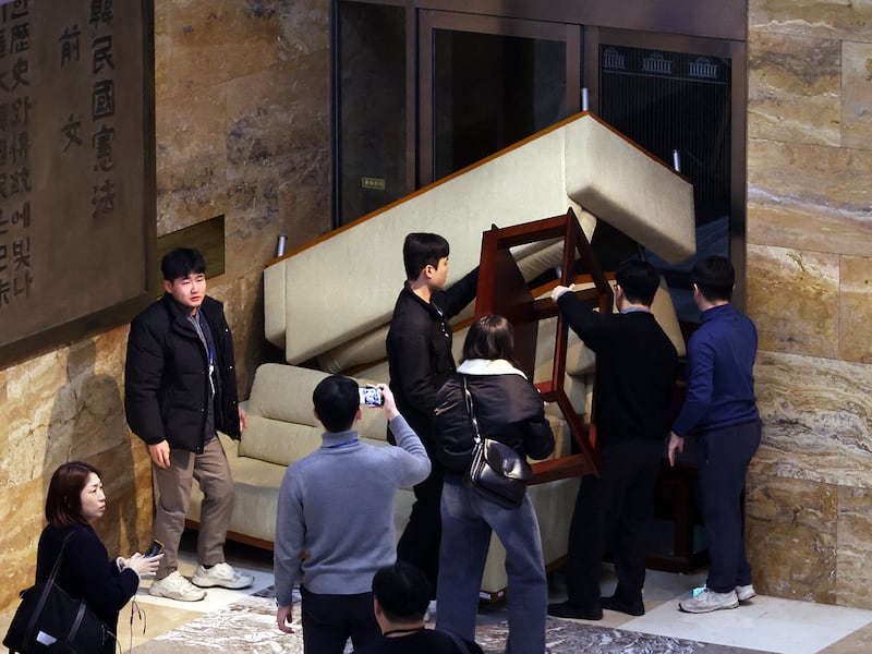 South Korea's main opposition Democratic Party's staff set up a barricade to block soldiers at the National Assembly after South Korean President Yoon Suk Yeol declared martial law in Seoul, Dec. 3, 2024.