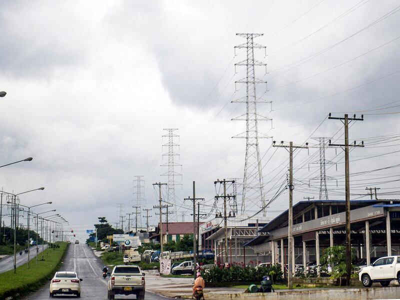 Power distribution lines originating from a hydro power plant that runs through Pak Se district, Champasak province, Laos, July 25, 2018.