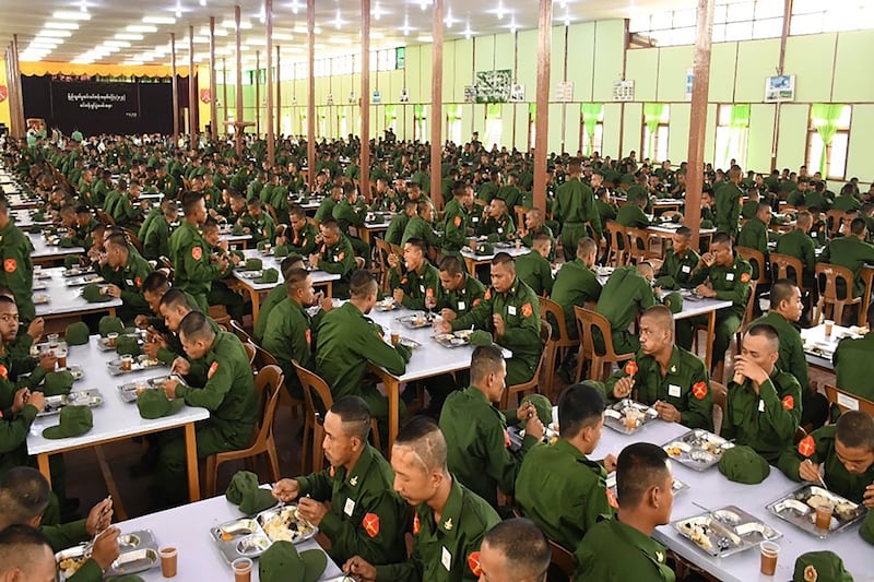 In this undated photo released on April 8, 2024, by The Military True News Information Team, military service eat at a military compound in Yangon.