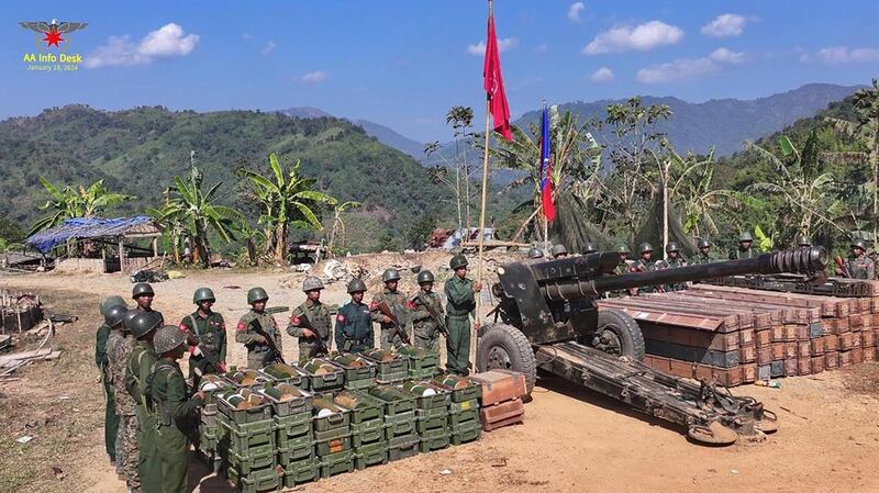 Arakan Army fighters pose with confiscated arms, ammunition and military devices after taking control of Light Battalion 289 and Military Operations Command 19 of Myanmar junta in Paletwa, Chin state, Jan. 18, 2024. (AA Info Desk)