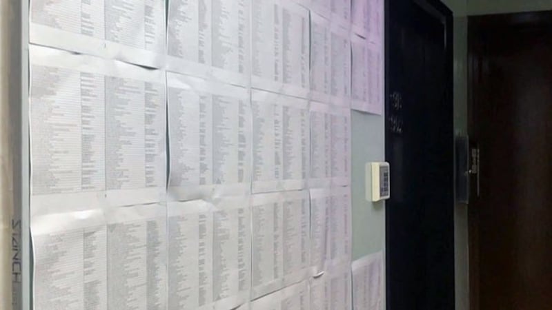 Sheets of paper tacked to the outside wall of an empty office unit in Hong Kong's Sheung Wan area in December 2018 list more than 1,800 firms that are likely shell companies using the location as their main business address. The office is just down the street from a company providing business registration services to mainland Chinese.