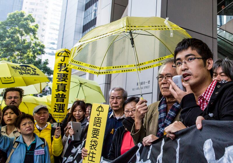 Hong Kong student leader Alex Chow speaks after arriving at the police headquarters to assist investigations in relation to the Occupy civil disobedience movement, in Hong Kong, Jan. 18, 2015. Credit: Reuters