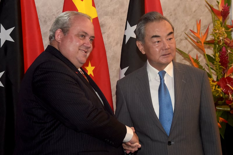 Papua New Guinea's Foreign Minister Justin Tkatchenko, left, and China's Foreign Minister Wang Yi in Port Moresby, April 20, 2024.