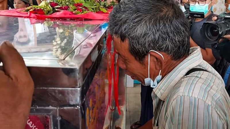 myanmar-grieving-relative-shooting-victim-north-okkalapa-yangon-mar5-2021.jpg