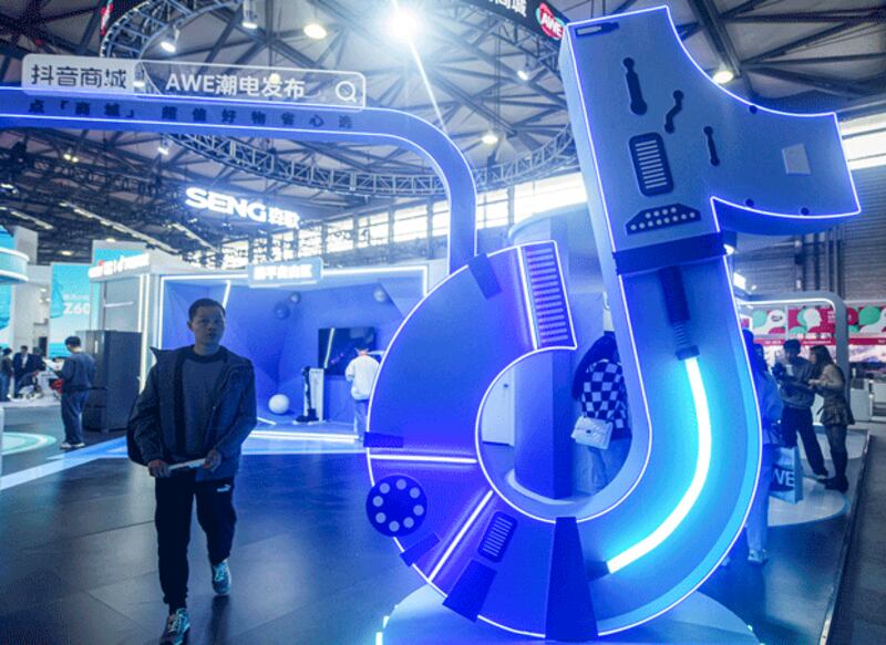 A man walks past a TikTok booth during the Appliance & Electronics World Expo in Shanghai, China, March 14, 2024. (AFP)