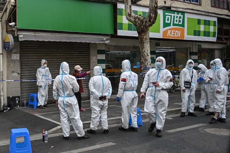 Residents queue to undergo nucleic acid tests for the Covid-19 coronavirus in Yantai, in China's eastern Shandong province, March 14, 2022. Credit: AFP