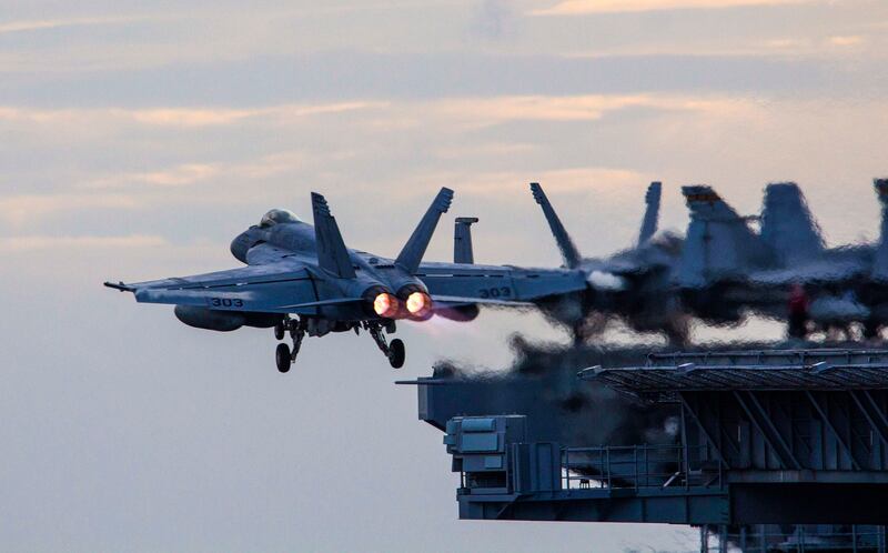 The Theodore Roosevelt and Nimitz Carrier Strike Groups steam in formation in the South China Sea on Feb. 9, 2021. Credit: U.S. Navy