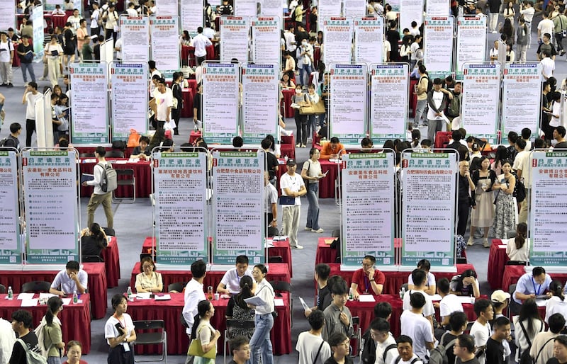 People attend a job fair for university graduates at a gymnasium in Hefei, Anhui province, Sept. 4, 2023. China's youth unemployment was above 20% before the government stopped publishing that statistic in August. Credit: China Daily via Reuters