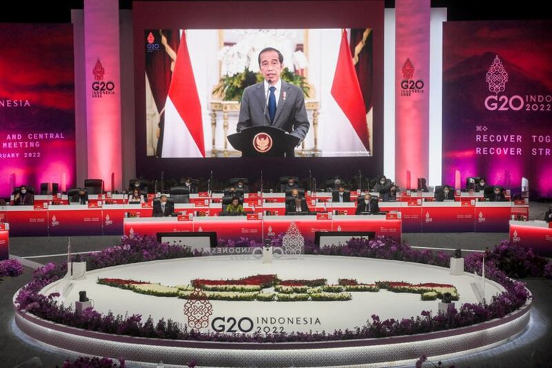 Indonesian President Joko “Jokowi” Widodo is seen on a screen delivering his speech during the G-20 finance ministers and central bank governors meeting at the Jakarta Convention Center, Feb. 17, 2022. Credit: Reuters