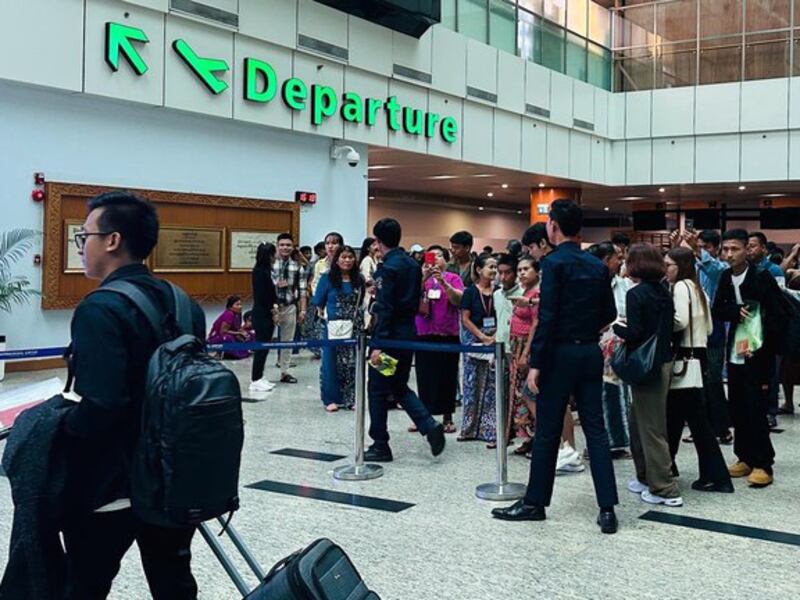 Travelers line up in the departure terminal at Yangon International Airport in Yangon, Myanmar, June 2024.