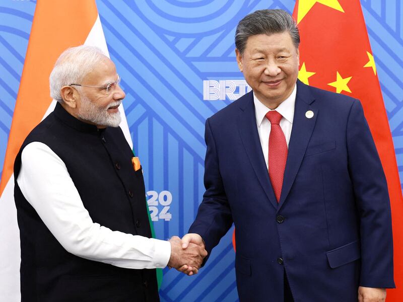 Chinese President Xi Jinping, right, meets with Indian Prime Minister Modi at the BRICS summit. Oct. 23, 2024, in Kazan, Russia.