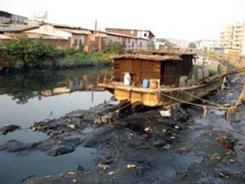 A grounded boat in the polluted Dong River near Guangzhou, China, July 2011.