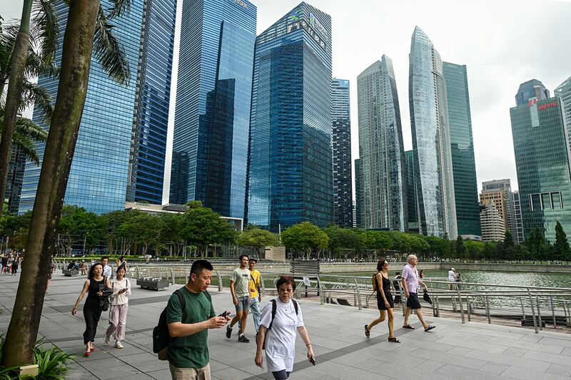 People walk along the promenade at Marina Bay in Singapore on Jan. 27, 2025.