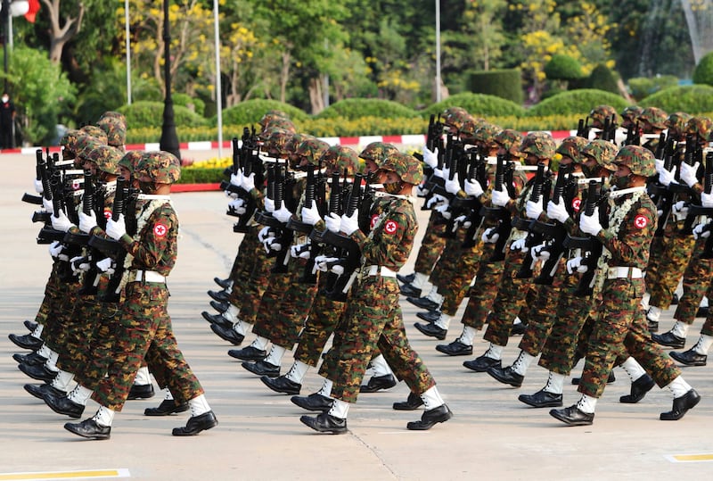 In this March 27, 2022 photo, soldiers of the Myanmar military march during a parade to commemorate 77th Armed Forces Day in Naypyitaw, Myanmar. Credit: AP Photo/Aung Shine Oo