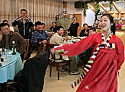 North Korean waitress dances