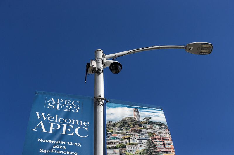 A security camera next to a banner for Asia-Pacific Economic Cooperation summit in San Francisco, California, Nov. 11, 2023. Protesters are planning a large-scale event on Wednesday against the Chinese President Xi Jinping in San Francisco on Wednesday, on the sidelines of the APEC leader's meeting. Credit: Jason Henry/ AFP