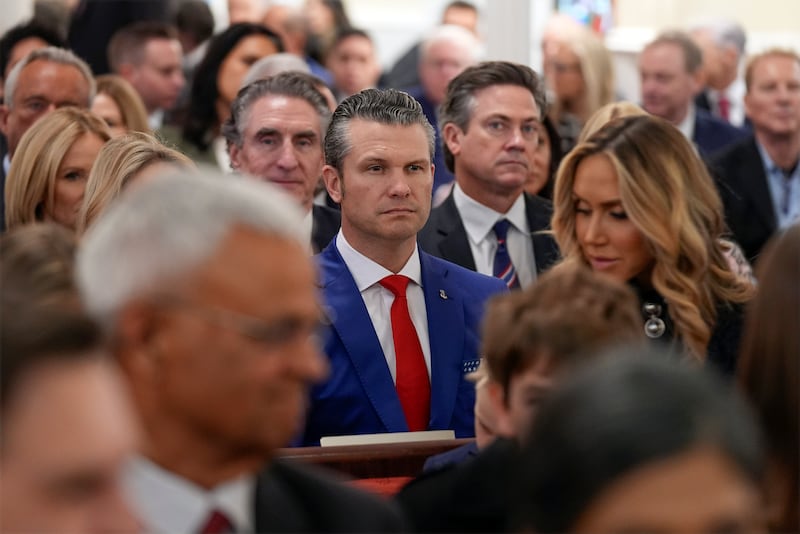 Defense Secretary-nominee Pete Hegseth (center, red tie) attends the service at St. John's Episcopal Church in Washington, Jan. 20, 2025.