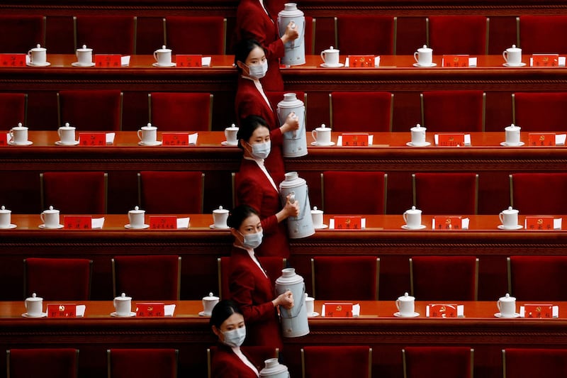 Attendants serve tea for delegates before the opening ceremony of the 20th National Congress of the Communist Party of China, at the Great Hall of the People in Beijing, China, Oct. 16, 2022. Credit: Reuters