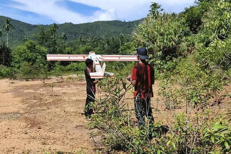 Two resistance fighters from the PDF Myeik District Battalion No. 1 handle a drone in Myeik district in southern Myanmar's Tanintharyi Region, Oct. 4, 2024. (PDF Myeik District Battalion 1)