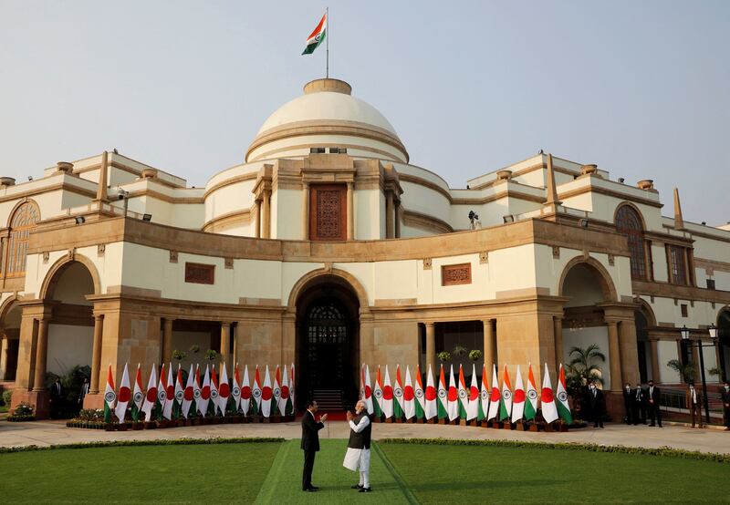 Indian Prime Minister Narendra Modi welcomes Japanese Prime Minister Fumio Kishida ahead of their meeting at Hyderabad House, in New Delhi, India, March 19, 2022. Credit: Reuters