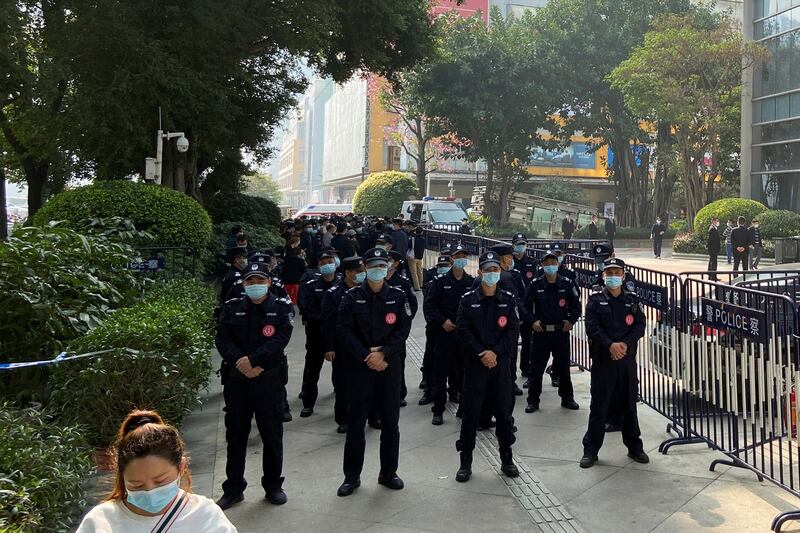 Police officers stand guard outside the Evergrande International Center in Guangzhou, Guangdong province, China, Jan. 4, 2022. Credit: David Kirton/Reuters