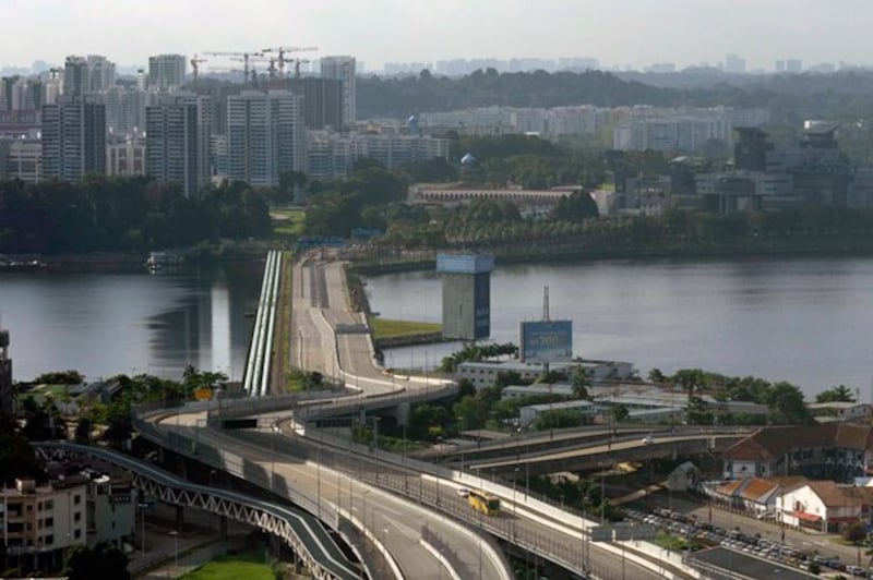 A bus crosses the Johor-Singapore Causeway from Johor Bahru, Malaysia, Nov. 29, 2021. (Vincent Thian/AP)