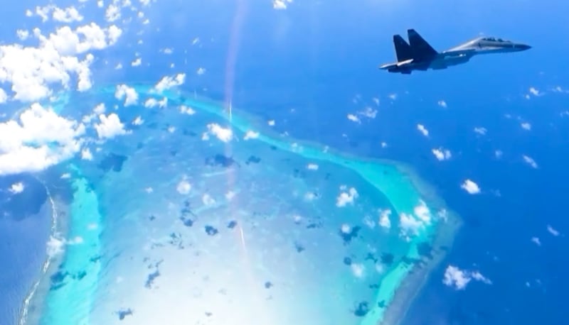 A Su-30 fighter jet from China’s Southern Theater Command is seen flying over Scarborough Shoal in the South China Sea on Dec. 29, 2024.