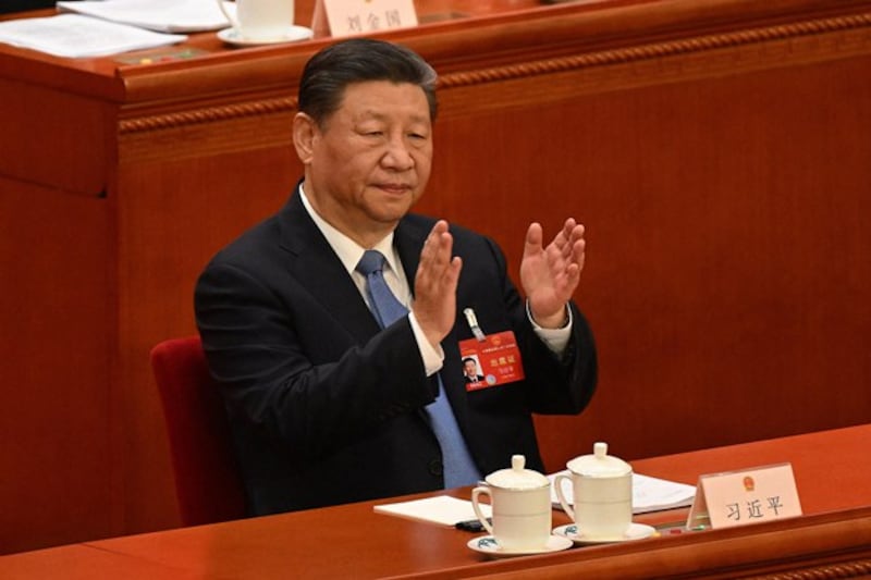 China's President Xi Jinping applauds during the second plenary session of the 14th National People's Congress at the Great Hall of the People in Beijing, March 8, 2024. (Jade Gao/AFP)