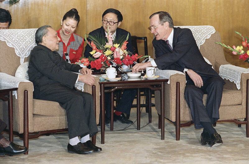 U.S. President George W. Bush meets with Chairman Deng Xiaoping in 1989 at the Great Hall of the People in Beijing. (Doug Mills/AP)