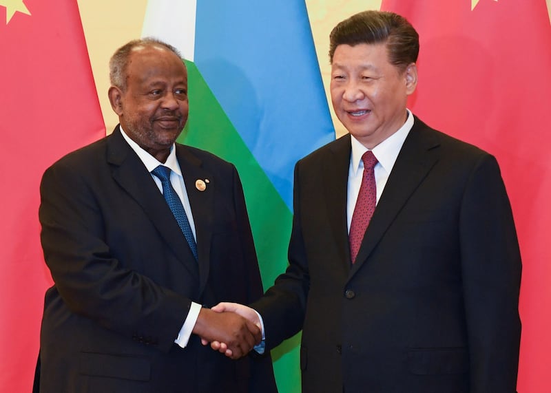 China's President Xi Jinping shakes hands with Djibouti's President Ismail Omar Guelleh before a meeting at the Great Hall of the People in Beijing, April 28, 2019. Credit: Madoka Ikegami/Pool via Reuters