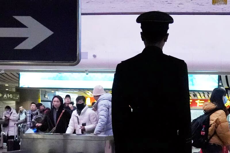 A security guard patrols Beijing West Railway Station on Jan. 24, 2025.