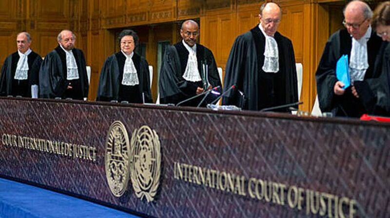 Presiding judge Abdulqawi Ahmed Yusuf (C) and other judges take their seats at the International Court of Justice in The Hague, the Netherlands, Jan. 23, 2020.