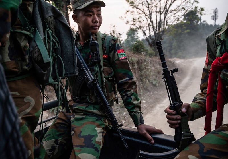 Ta'ang National Liberation Army troops ride on a truck near Namhsan township in Myanmar's northern Shan state, March 9, 2023. Credit: AFP