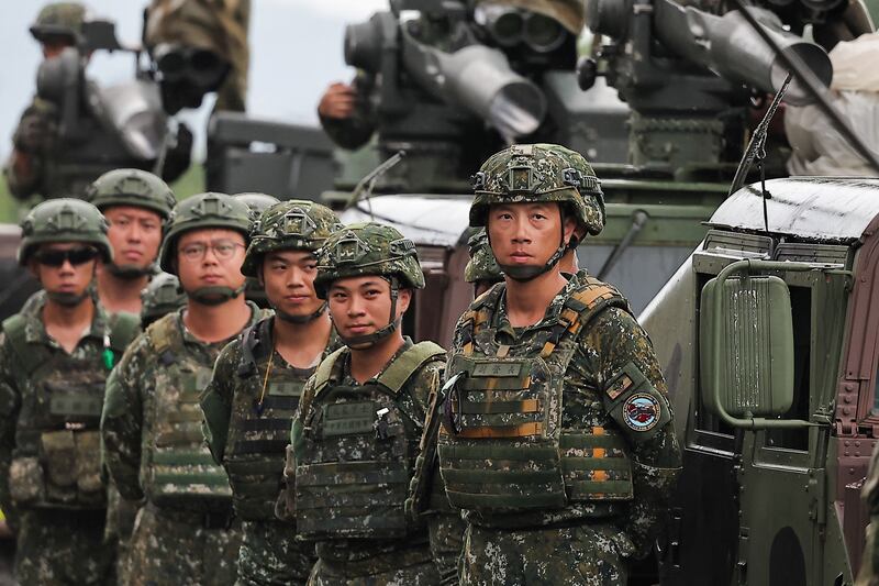 Soldiers stand next to M1167 TOW carrier vehicle at the Fangshan training grounds in Pingtung, Taiwan, Aug. 26, 2024.