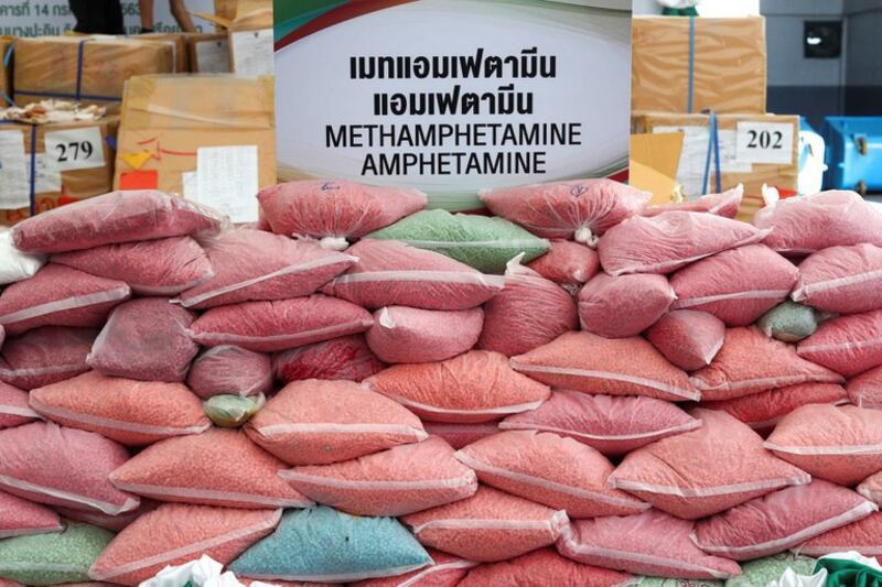 Law enforcers display bags of seized methamphetamine tablets during the 50th Destruction of Confiscated Narcotics ceremony in Ayutthaya province, Thailand, June 26, 2020. Credit: Reuters.