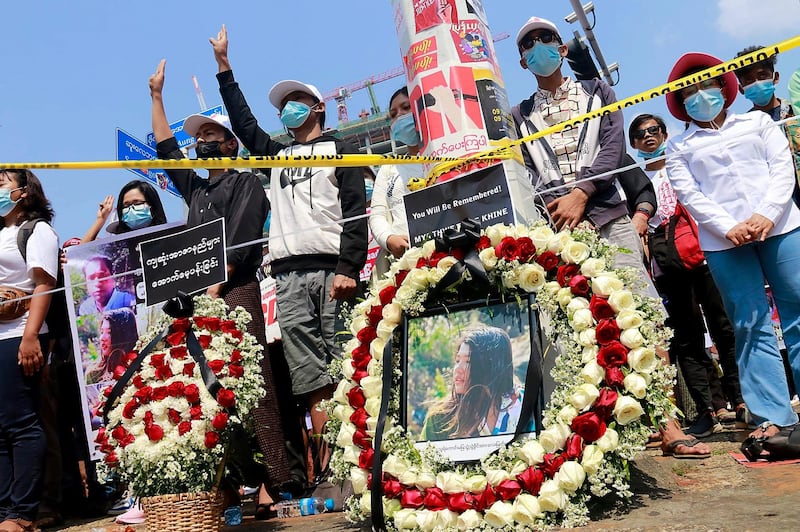 Protesters hold banners commemorating 20-year-old Mya Thwe Thwe Khine, the first protester killed in nearly three weeks of demonstrations against Myanmar's military coup, Yangon, Feb. 20, 2021. Credit: RFA