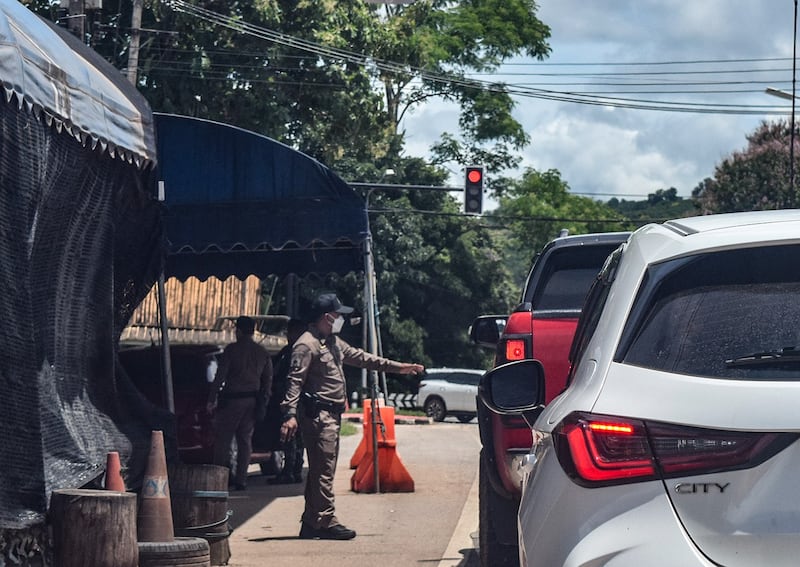 3 Soldiers check vehicles near Thong Pha Pum in Kanchanaburi on Aug. 18, 2024.JPG