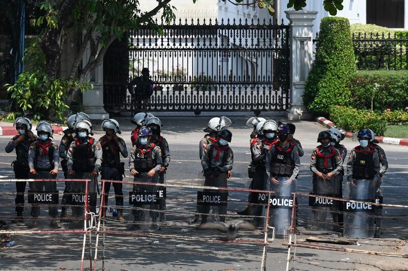 Police stand guard near the US embassy during a demonstration by protesters against the military coup in Yangon, Feb. 22, 2021. Credit: AFP