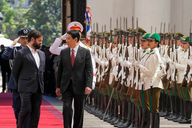 Chilean President Gabriel Boric, left, welcomes Vietnam's President Luong Cuong to La Moneda presidential palace in Santiago, Chile, Monday, Nov. 11, 2024.