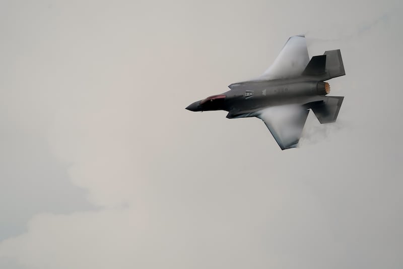 Vortices are visible on its wings as a U.S. Air Force F-35A demonstration team fifth generation jet performs over Don Mueang air base in Bangkok, March 7, 2025.