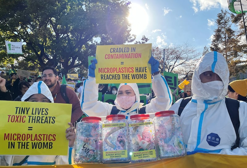 Climate activists march on a street to demand stronger global commitments to fight plastic waste at the upcoming fifth session of the Intergovernmental Negotiating Committee in Busan, South Korea, Nov. 23, 2024.