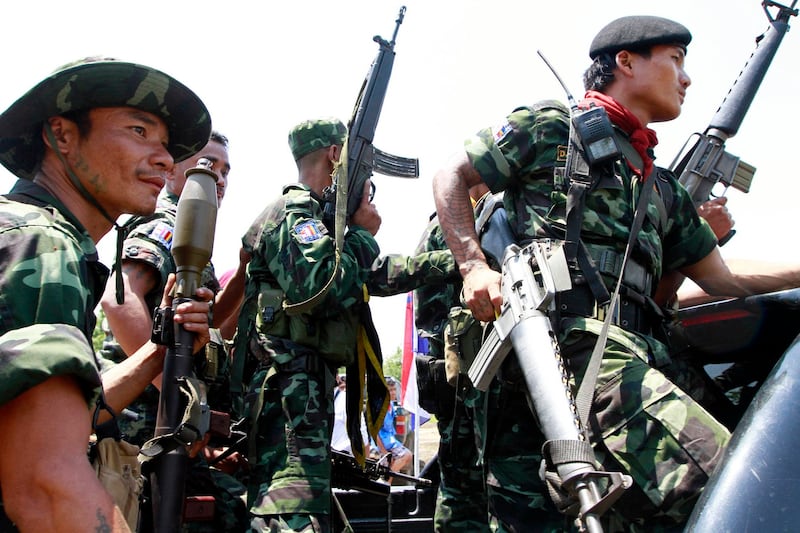 Soldiers from the Democratic Karen Buddhist Army (DKBA) provide security near their camp in Myawaddy, Karen state, Myanmar, close to the border with Thailand, in 2012. Credit: Khin Maung Win/Associated Press