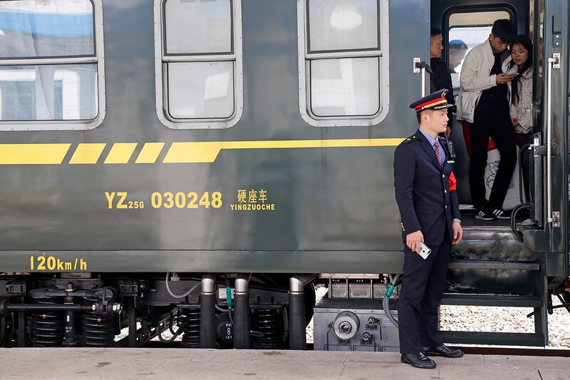 Passengers disembark at Huangchuan Railway Station on Jan. 21, 2025, in Xinyang, Henan province, China.