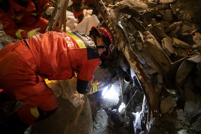 Rescuers search for victims at the site of a school gymnasium roof collapse at Qiqihar No. 34 Junior High School in Qiqihar in northeast China's Heilongjiang province on Monday, July 24, 2023. At least 11 people were killed in the accident. Credit: Zhang Tao/Xinhua via AP