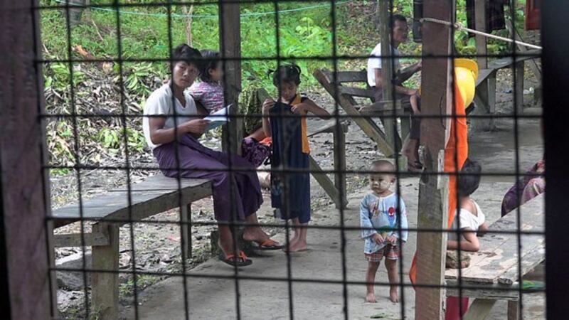 Villagers who fled a conflict zone in Paletwa township, eastern Myanmar's Chin state, take refuge in a temporary camp for displaced persons at the Ngazinyaing Chaung Monastery compound in Sittwe, capital of neighboring Rakhine state, Aug. 10, 2020.